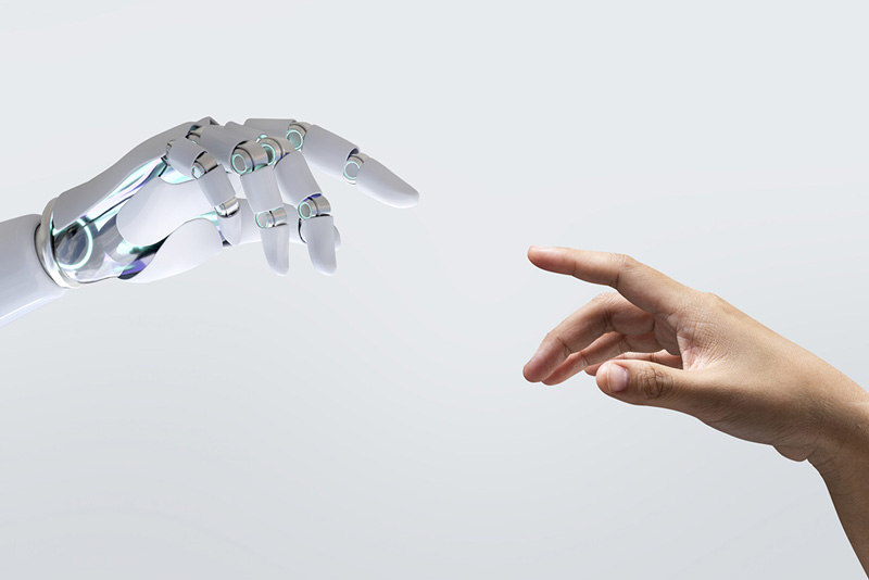 ρομποτικό χέρι προσπαθεί να ακουμπήσει ένα ανθρώπινο χέρι